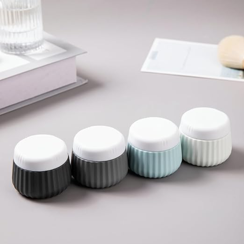 Flacon Vide Voyage pour Crème quatre flacons alignés - Beige - Rose - Vert - Bleu - Multicouleur