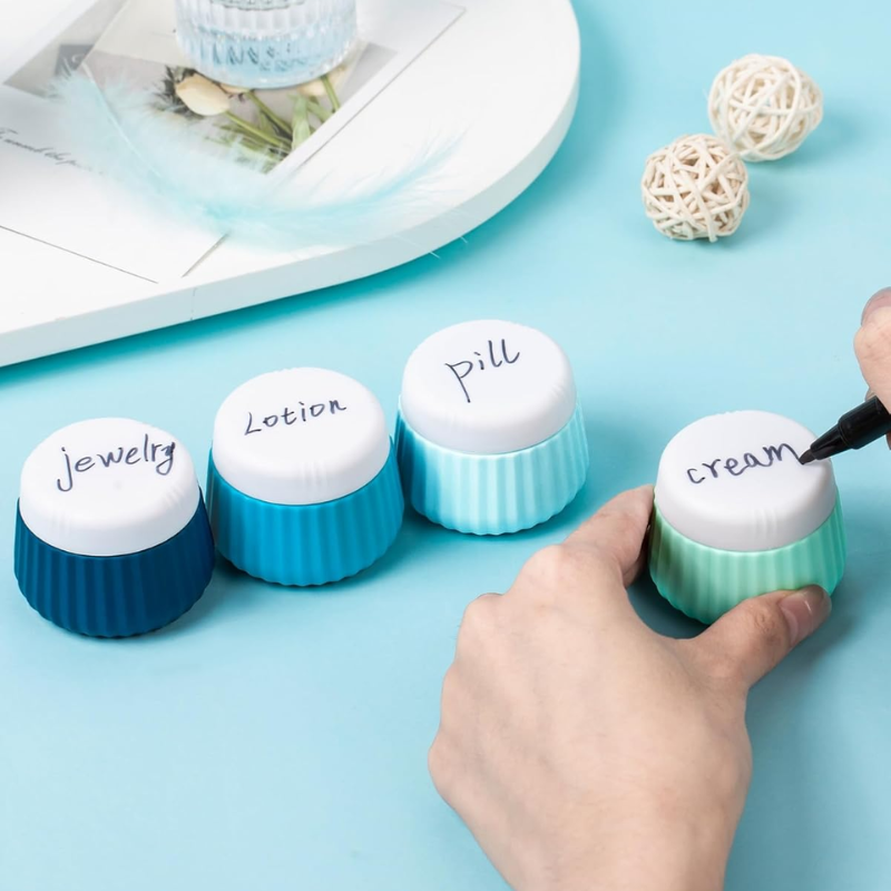 Flacon Vide Voyage pour Crème quatre flacons alignés - Beige - Rose - Vert - Bleu - Multicouleur